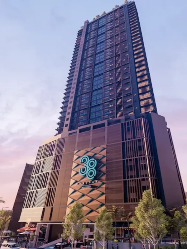 Residensi 38 Bangsar — the 38-storey tower at dusk with the illuminated 38 emblem