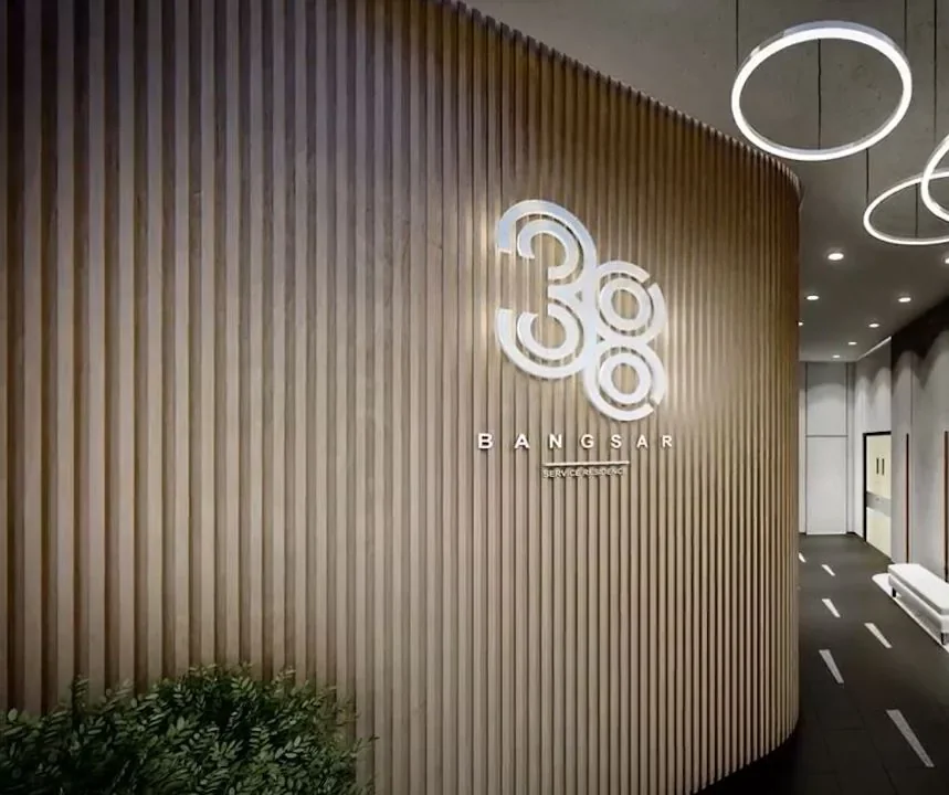 Residensi 38 Bangsar — curved timber-battened arrival lobby with sculptural lighting