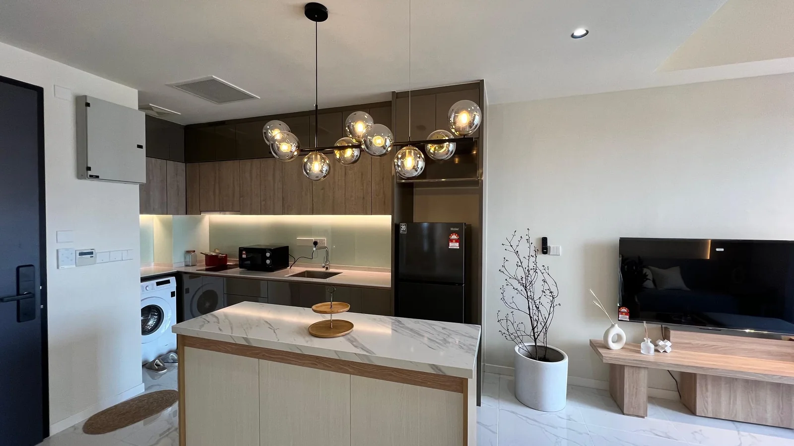 Residensi 38 Bangsar show unit — open kitchen with island and pendant lighting