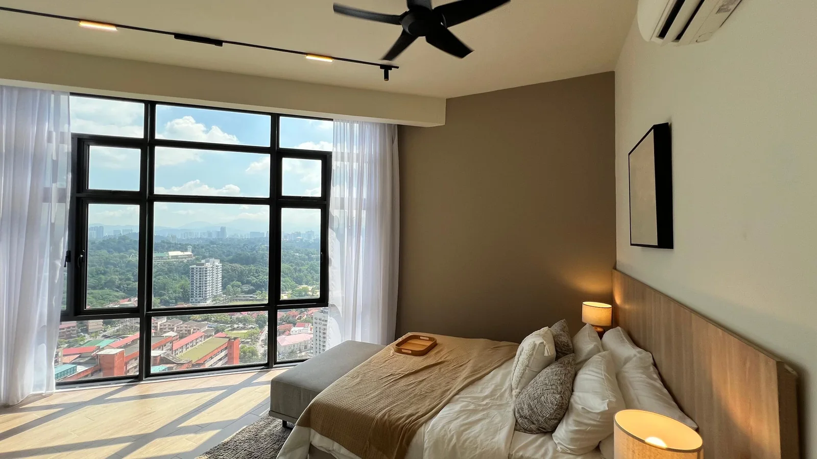 Residensi 38 Bangsar show unit — bedroom with corner city-view windows