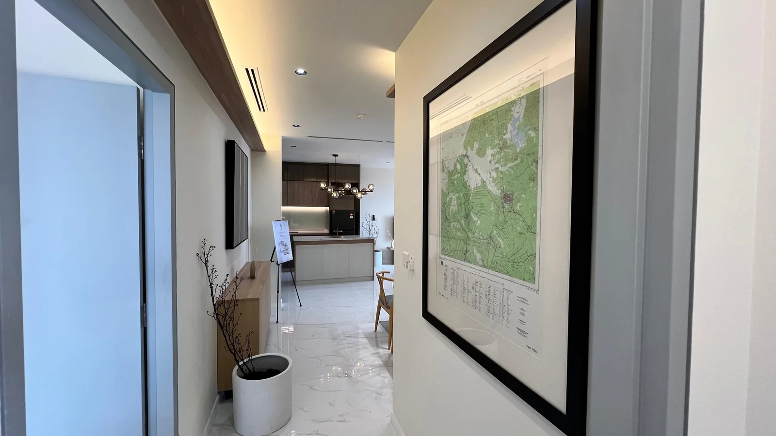 Residensi 38 Bangsar show unit — interior hallway with framed art