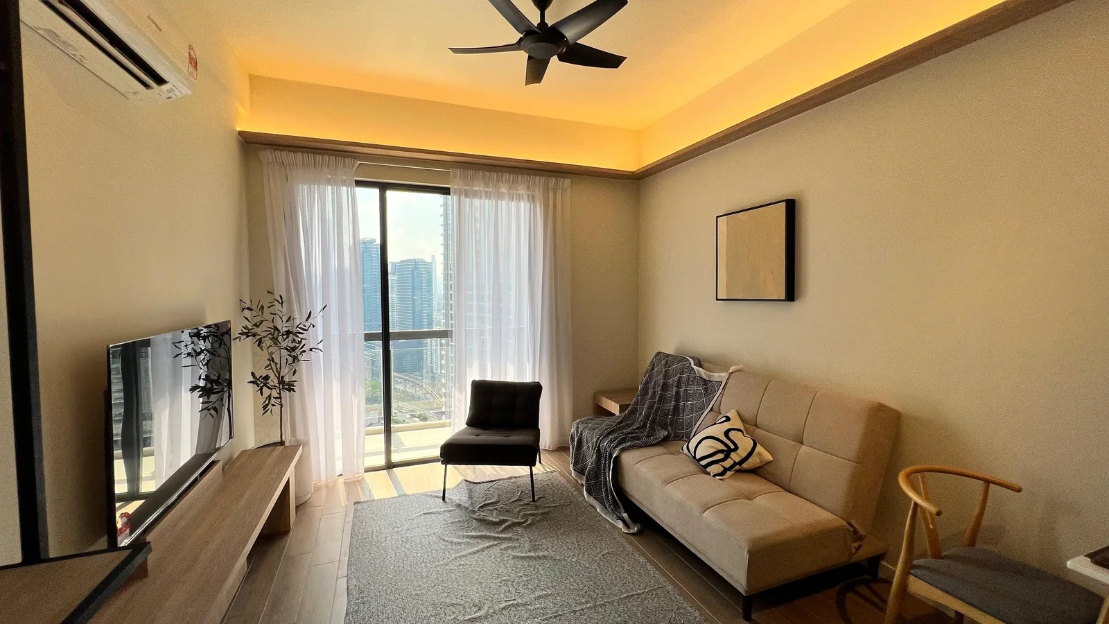 Residensi 38 Bangsar show unit — lounge with warm timber ceiling and balcony