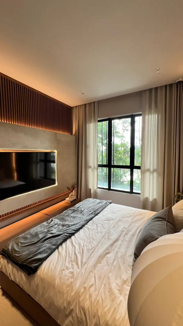 Amaya Residences show unit — master bedroom with backlit feature wall