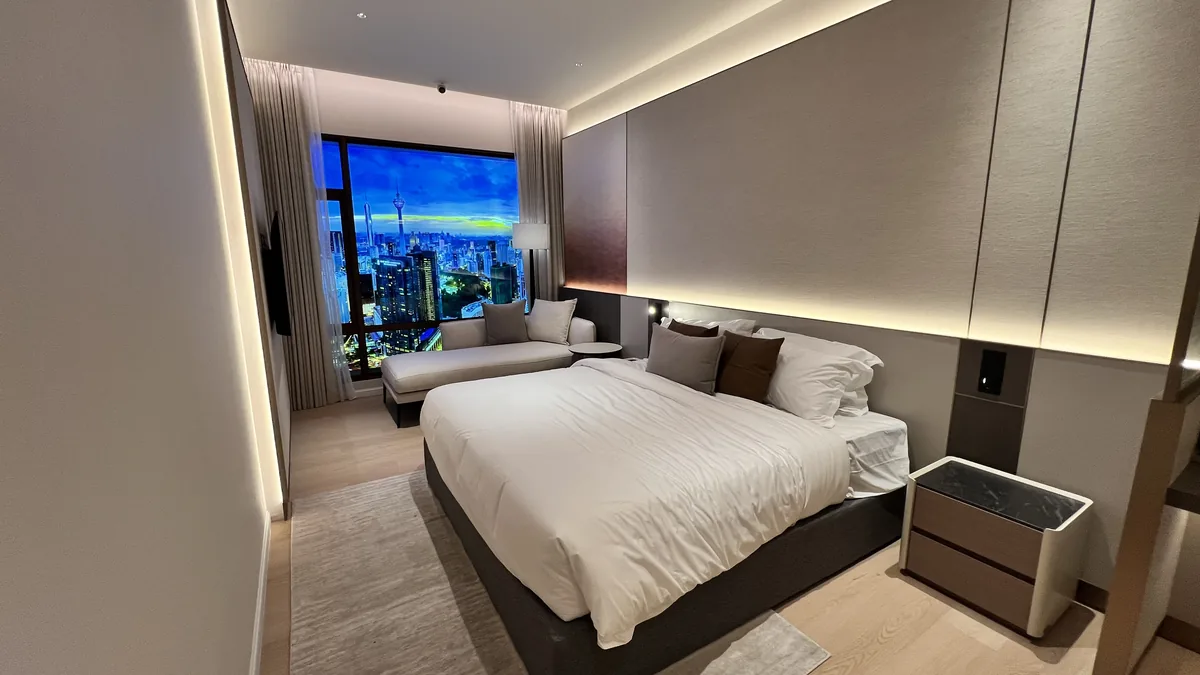 Armani Hallson show unit — master bedroom with panoramic KLCC view