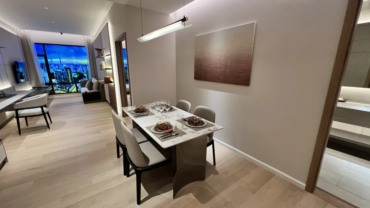 Armani Hallson show unit — dining area with artwork