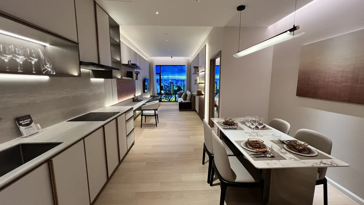 Armani Hallson show unit — kitchen and dining with skyline beyond