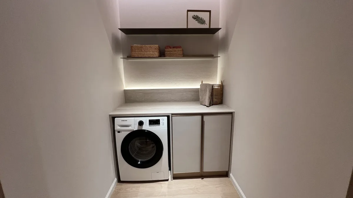 Armani Hallson show unit — laundry nook with washer