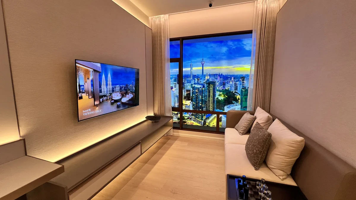 Armani Hallson show unit — living room nook with sofa and skyline view